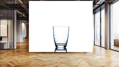 An empty glass for water, juice or milk Cocktail drink Household items Isolated on white background Wall mural