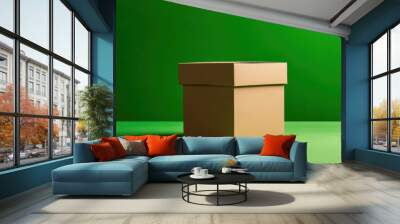 A brown cardboard box on a vibrant green background, perfect for packaging and shipping concepts. Wall mural