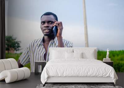 African American black man Using Mobile phone. Wall mural