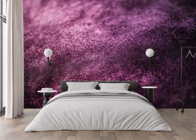 Abstract close-up of a textured surface with purple and black tones. Wall mural