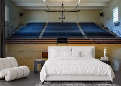 Empty basketball court with bleachers and a single bench in the center. Wall mural