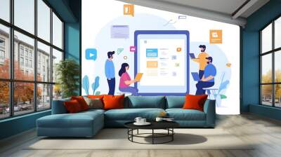 Four diverse people working together on a large digital screen with laptops. Wall mural