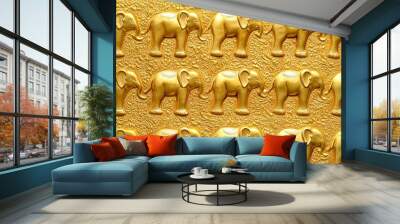 Golden elephant carvings on a textured gold surface. Wall mural