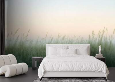 Tall grass blowing in the wind with a pastel sky in the background. Wall mural