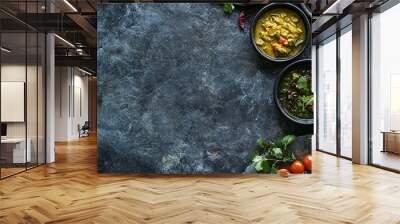 Top view of various Indian dishes served in bowls and arranged on a dark background with copy space. Wall mural