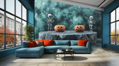 Two skeletons and two jack-o-lanterns stand on a black marble pedestal with a teal smoky background. Wall mural