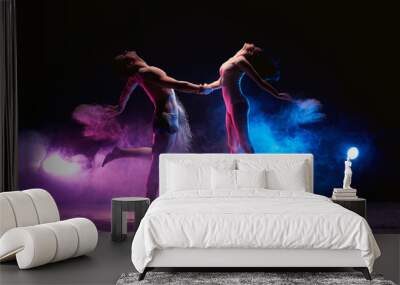 Couple dancing on the scene in cloud of powder Wall mural