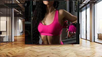 Gorgeous fitness model in a gym shot Wall mural