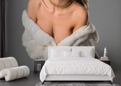 Sexy blonde woman undress white fur coat and look at camera Wall mural