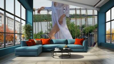 Woman in White Dress on Balcony Wall mural