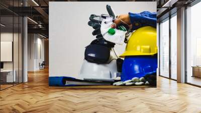 works safety concept: ppe (personal protective equipment), hard hat or industrial helmet for protect Wall mural