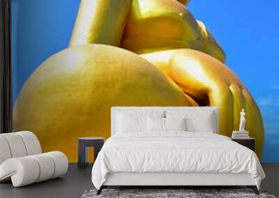 The large buddha statue image has a sky backdrop. Wall mural