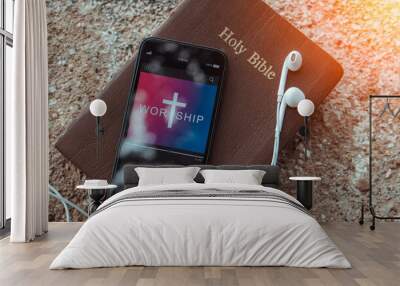 bible with phone and headphones,Concept listen worship song. Wall mural