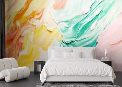 Soft yet vibrant acrylic paint strokes of mint green, pastel yellow, and coral pink, swirling together in an abstract flow against a white backdrop. Wall mural