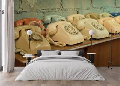 vintage telephones on the table Wall mural