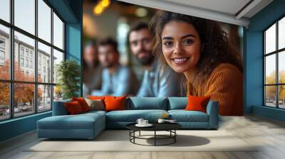 Smiling Confident Woman with Curly Hair Looking at Camera Wall mural