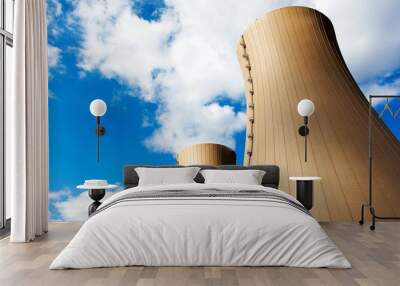 Nuclear power plant against blue sky and clouds Wall mural