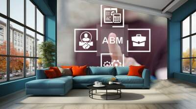 Man working on virtual touch screen presses abbreviation: ABM. ABM Account Based Marketing Concept. Business Web Marketing Technology. Wall mural