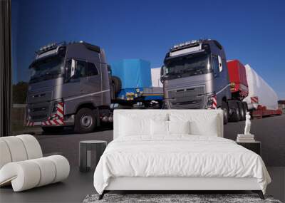 Oversize Load or exceptional convoy. A two truck with a special semi-trailers for transporting oversized loads. Wall mural