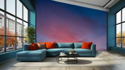 Dramatic sky with big clouds in the sunset. The sun is beautifully breaking through the clouds. Vertical Wall mural