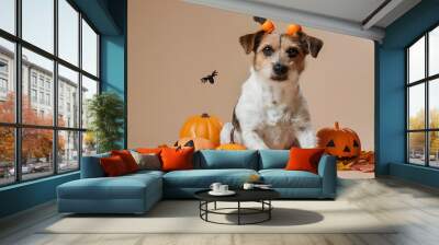 Cute dog with pumpkins and Halloween decorations on beige background Wall mural