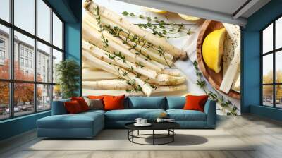 Dish with raw salsify roots, lemon and thyme on white wooden table, closeup. Space for text Wall mural