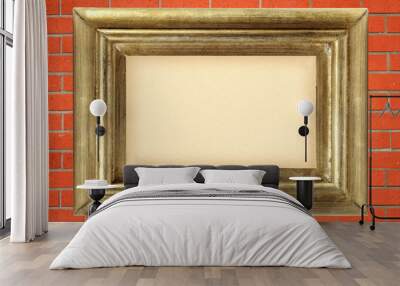 empty golden wooden frame on the red brick wall Wall mural