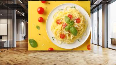 Tasty pasta with tomato, cheese and basil on yellow table, top view Wall mural