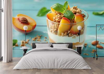 Tasty peach dessert with yogurt and granola on light blue wooden table Wall mural