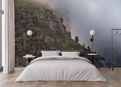 Table mountain from bottom to top view during a foggy and cloudy day  Wall mural