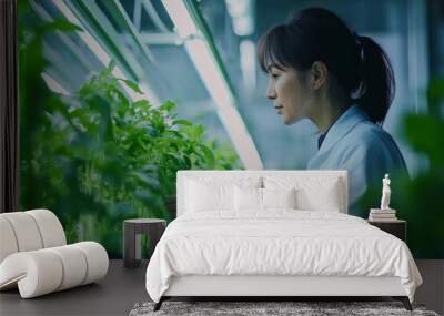 A senior Japanese female agriculture engineer analyzing data on crop performance using an advanced monitoring system in a futuristic farm. Her decades of experience meet modern technological Wall mural