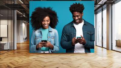 black woman and black man with phone on blue background. . Wall mural