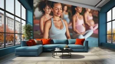 Group of expecting moms in a prenatal yoga class, smiling and practicing wellness Wall mural