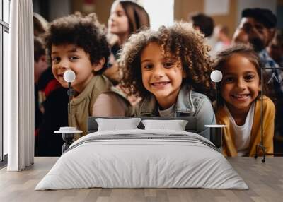 Happy diverse junior school students children group looking at camera standing in classroom. Smiling multiethnic cool kids boys and girls friends posing for group portrait together Wall mural