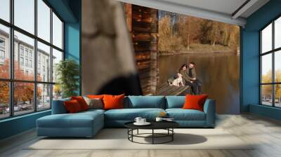 Lovely couple spending autumn day outdoors Wall mural