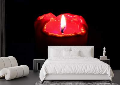 The red candle burns in the dark during the ritual. Wall mural