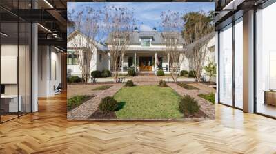 Front view of large expensive two story home with front garden Wall mural