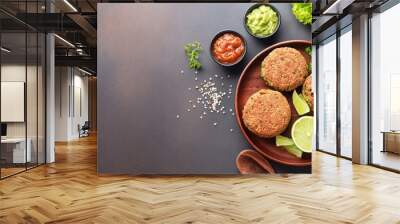 Quinoa burgers with guacamole and salsa ingredients with copy space, top view; healthy vegan food concept on a dark background;, paleo or ketogenic diet idea Wall mural