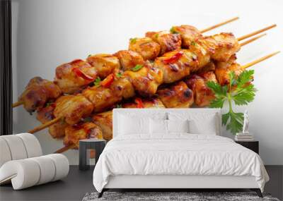 A plate of chicken skewers with a bunch of parsley on the side Wall mural