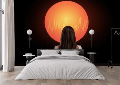 A woman is sitting at a table looking at a glowing red circle Wall mural