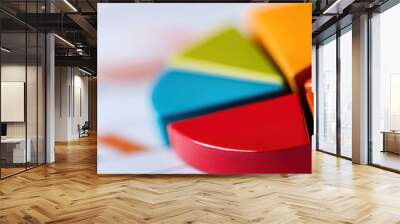 Close-up of a colorful pie chart on a blurred background. Ideal for finance, business analysis, statistics, and research presentations. Wall mural