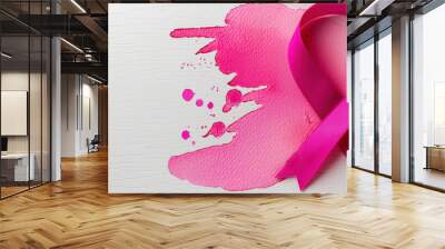 Pink ribbon with pink paint splatters on a white background Wall mural