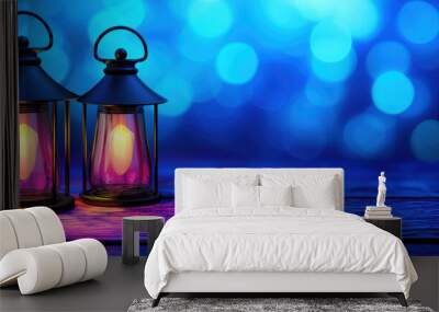 Two decorative lanterns glow softly against a dreamy blue backdrop, creating a tranquil and inviting atmosphere. Wall mural