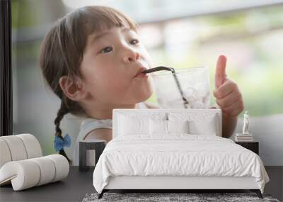 Asian girl drinking at cafe Wall mural