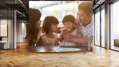 Family eating at cafe Wall mural