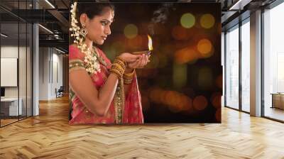 Indian girl hands holding diwali lights Wall mural