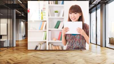 chinese female tablet computer enjoying Internet surfing at her Wall mural