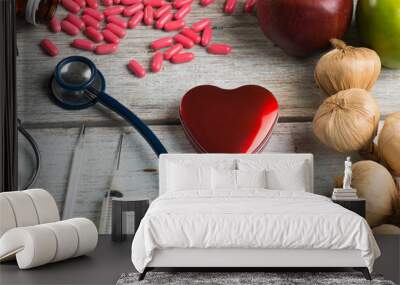 healthcare concept balance between medicine and healthy foods Wall mural