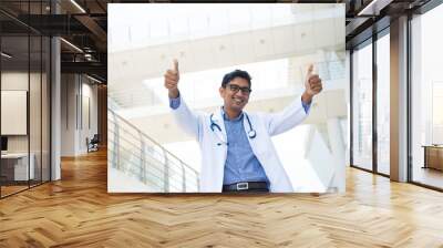 indian male doctor with two thumbs up Wall mural