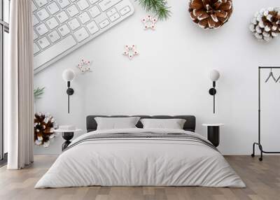 Top view home office desk with computer, pine branches and christmas decorations. Flat lay with white copy space. Christmas concept Wall mural